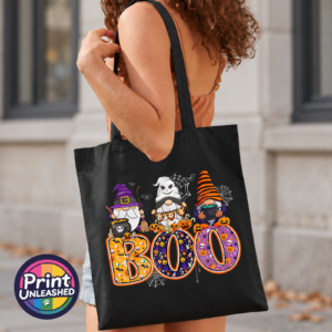 Gonks Boo black model 2 Three Halloween gonks with witch hats, cauldrons and pumpkins above colourful patterned BOO lettering, printed on a tote bag model - Print Unleashed