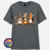 Three autumn gonks in witch hats with pumpkins, a takeaway cup, a black cat and falling leaves printed on a unisex T-shirt charcoal - Print Unleashed