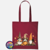 Three autumn gonks in tall pointed hats with pumpkins, a takeaway cup, a black cat and falling leaves printed on a deep red tote bag - Print Unleashed