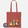 Three autumn gonks in tall pointed hats with pumpkins, a takeaway cup, a black cat and falling leaves printed on a tote bag in orange rust - Print Unleashed