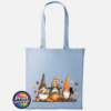 Three autumn gonks in tall pointed hats with pumpkins, a takeaway cup, a black cat and falling leaves printed on a sky blue tote bag - Print Unleashed