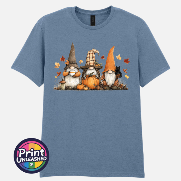 Three autumn gonks in witch hats with pumpkins, a takeaway cup, a black cat and falling leaves printed on a unisex T-shirt stone blue - Print Unleashed