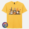 Three autumn gonks in witch hats with pumpkins, a takeaway cup, a black cat and falling leaves printed on a unisex T-shirt yellow - Print Unleashed