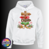 Gingerbread-style signpost pointing to Gingerbread Village, Peppermint Post, Cookie Kitchen and Gumdrop Lane, with sweets and biscuits, printed on a white unisex hoodie - Print Unleashed