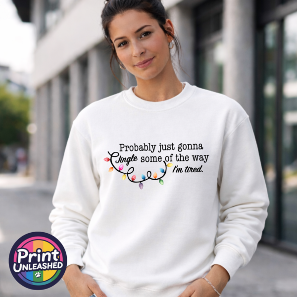 Jingle Tired sweat model Probably just gonna jingle some of the way I’m tired wording with colourful Christmas lights printed on a white unisex sweatshirt model - Print Unleashed