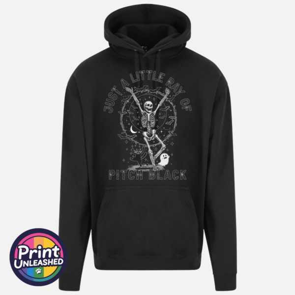 Just A Little Ray black Black everyday hoodie featuring a dancing skeleton surrounded by bats, stars, a crescent moon, a cat and ghost with Just a Little Ray of Pitch Black lettering - Print Unleashed