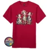 Three Christmas cows tangled in colourful lights, one wearing a Santa hat and another holding a candy cane, printed on a cherry red premium unisex T-shirt - Print Unleashed