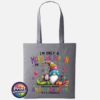 Colourful Christmas gonk holding a steaming coffee mug beside presents, with funny Christmas morning person wording, printed on a slate tote bag - Print Unleashed