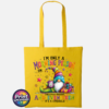 Colourful Christmas gonk holding a steaming coffee mug beside presents, with funny Christmas morning person wording, printed on a sunflower tote bag - Print Unleashed