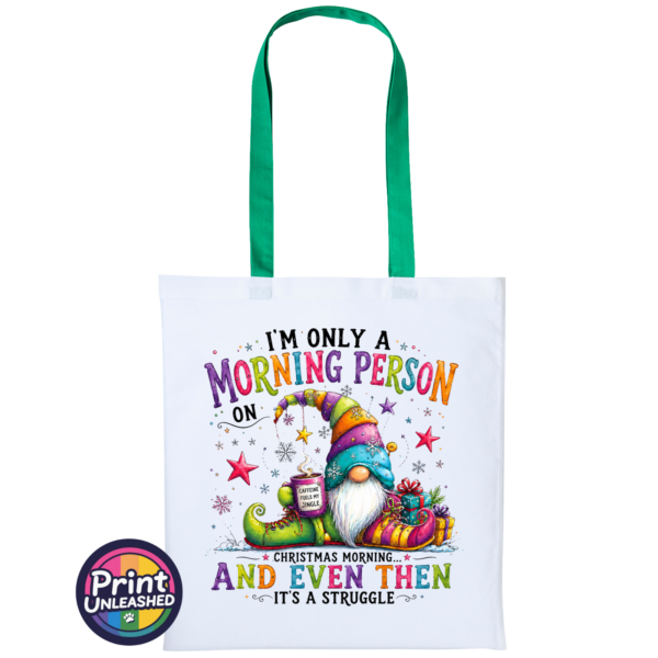 Morning Person Gonk white-green Colourful Christmas gonk holding a steaming coffee mug beside presents, with funny Christmas morning person wording, printed on a white & green tote bag - Print Unleashed