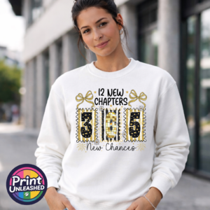 12 new chapters 365 new chances wording with black and gold patterned numbers, bows, flowers and fireworks printed on a white unisex sweatshirt model - Print Unleashed