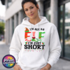 I’m not an elf I’m just short wording with red and green elf-style letters, striped stockings, holly and Christmas lights printed on a white unisex hoodie model image - Print Unleashed
