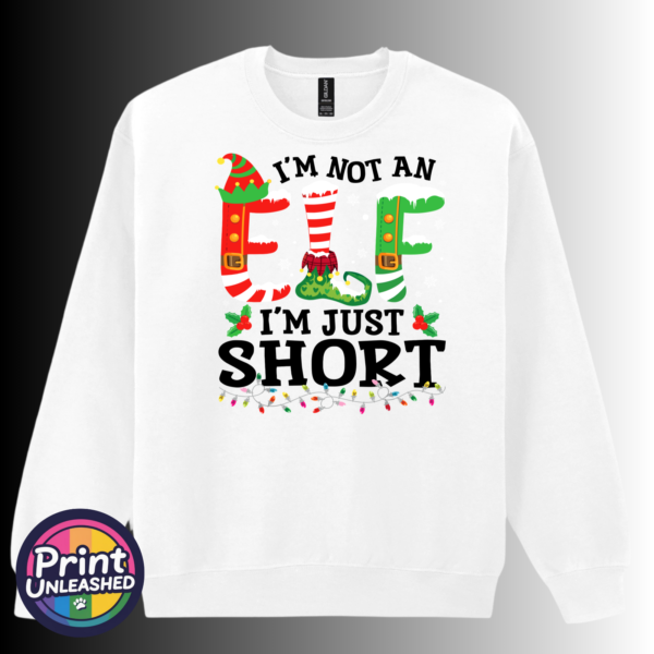 Not An Elf sweat Iām not an elf Iām just short wording with red and green elf-style letters, striped stockings, holly and Christmas lights printed on a white unisex sweatshirt - Print Unleashed