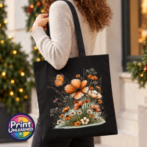 Copper, peach and cream wildflowers with delicate grasses and an orange butterfly printed on a tote bag model - Print Unleashed