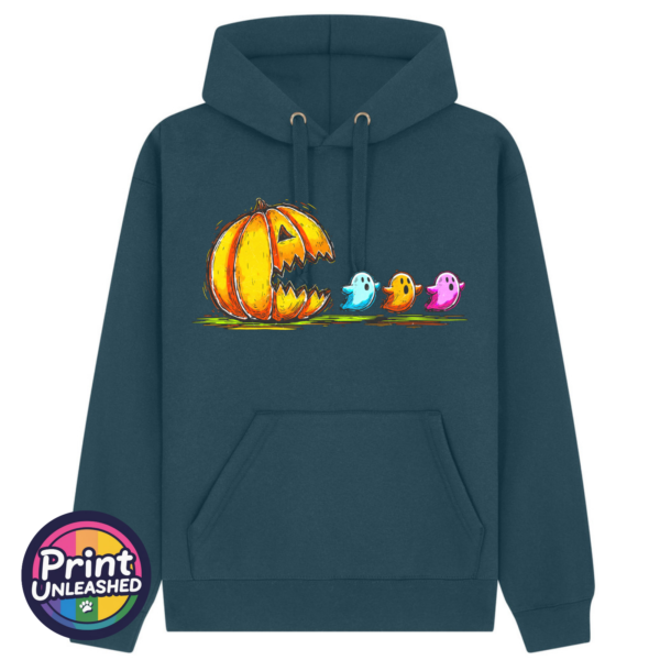 Orange pumpkin with an open jagged mouth facing three colourful ghosts in a retro arcade-inspired design, printed on a Premium Hoodie indigo - Print Unleashed