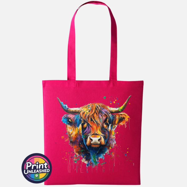 Highland cow portrait with a shaggy orange fringe, sweeping horns and vibrant blue, purple, yellow and green paint splashes printed on a tote bag hot pink - Print Unleashed