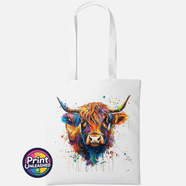 Highland cow portrait with a shaggy orange fringe, sweeping horns and vibrant blue, purple, yellow and green paint splashes printed on a tote bag white - Print Unleashed