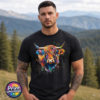 Highland cow portrait with a shaggy orange fringe, sweeping horns and vibrant blue, purple, yellow and green paint splashes printed on a unisex T-shirt model - Print Unleashed