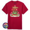 Gingerbread-style signpost pointing to Gingerbread Village, Peppermint Post, Cookie Kitchen and Gumdrop Lane, with sweets and biscuits, printed on a cherry red premium unisex T-shirt - Print Unleashed