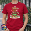 Gingerbread-style signpost pointing to Gingerbread Village, Peppermint Post, Cookie Kitchen and Gumdrop Lane, with sweets and biscuits, printed on a cherry red premium unisex T-shirt female model - Print Unleashed