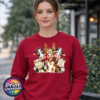 Three Christmas cows with antler glasses, earmuffs and Naughty or Nice and Santa’s Little Helper signs printed on a cherry red unisex sweatshirt female model - Print Unleashed