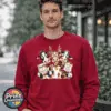 Three Christmas cows with antler glasses, earmuffs and Naughty or Nice and Santa’s Little Helper signs printed on a cherry red unisex sweatshirt male model - Print Unleashed