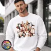 Three Christmas cows with reindeer antlers, earmuffs and signs reading Naughty or Nice and Santa’s Little Helper printed on a white unisex sweatshirt male model - Print Unleashed