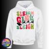 Colourful retro-style Sleigh Girl Sleigh lettering with black stars and a silhouette of Santa’s sleigh pulled by reindeer, printed on a white unisex hoodie - Print Unleashed
