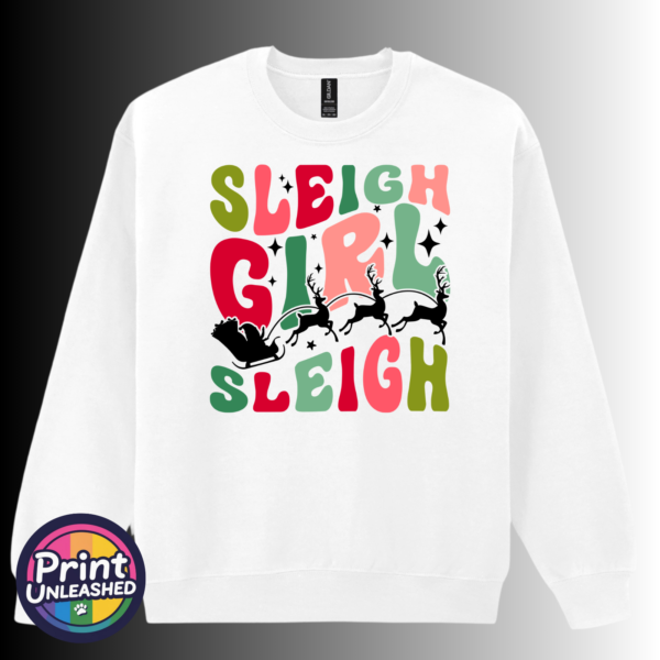 Sleigh Girl sweat Colourful retro-style Sleigh Girl Sleigh lettering with black stars and a silhouette of Santa’s sleigh pulled by reindeer, printed on a white unisex sweatshirt - Print Unleashed