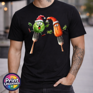 Sprout Carrot model male Startled Brussels sprout and carrot wearing Santa hats perched on forks, printed on a unisex T-shirt in black model - Print Unleashed