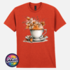 Teacup and saucer with copper and cream autumn leaves, berries and swirling orange steam printed on a unisex T-shirt in antique orange - Print Unleashed