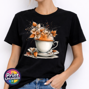 Teacup and saucer with copper and cream autumn leaves, berries and swirling orange steam printed on a unisex T-shirt model - Print Unleashed
