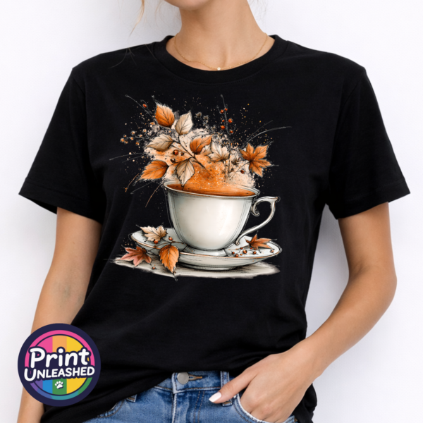 Tea model Teacup and saucer with copper and cream autumn leaves, berries and swirling orange steam printed on a unisex T-shirt model - Print Unleashed