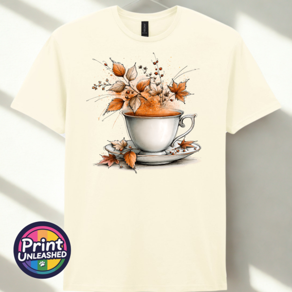 Tea off white Teacup and saucer with copper and cream autumn leaves, berries and swirling orange steam printed on a unisex T-shirt in off white - Print Unleashed