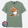 Teacup and saucer with copper and cream autumn leaves, berries and swirling orange steam printed on a sage unisex T-shirt - Print Unleashed