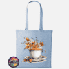 Teacup and saucer with copper and cream autumn leaves, berries and swirling orange steam printed on a tote bag sky - Print Unleashed
