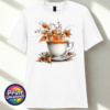 Teacup and saucer with copper and cream autumn leaves, berries and swirling orange steam printed on a white unisex T-shirt - Print Unleashed