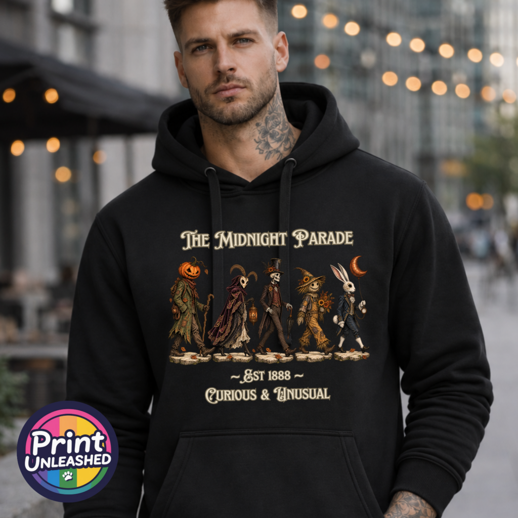 The Midnight Parade featuring a pumpkin-headed wanderer, horned masked figure, skeleton, scarecrow and rabbit with a crescent-moon balloon, printed on an Everyday Hoodie male model - Print Unleashed