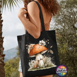 Toadstool black Copper-orange toadstool with white flowers and grasses on a tote bag model - Print Unleashed