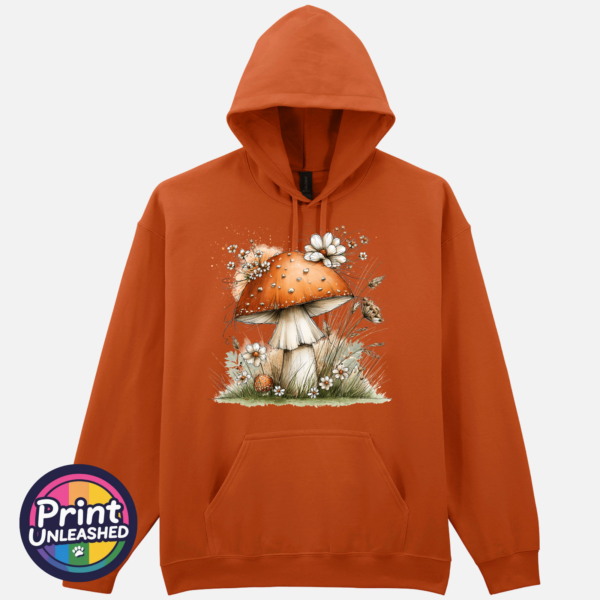 Copper-orange toadstool with white flowers and grasses on a softstyle hoodie orange - Print Unleashed