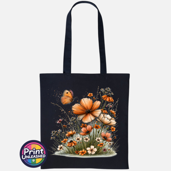 Copper, peach and cream wildflowers with delicate grasses and an orange butterfly printed on a tote bag black - Print Unleashed