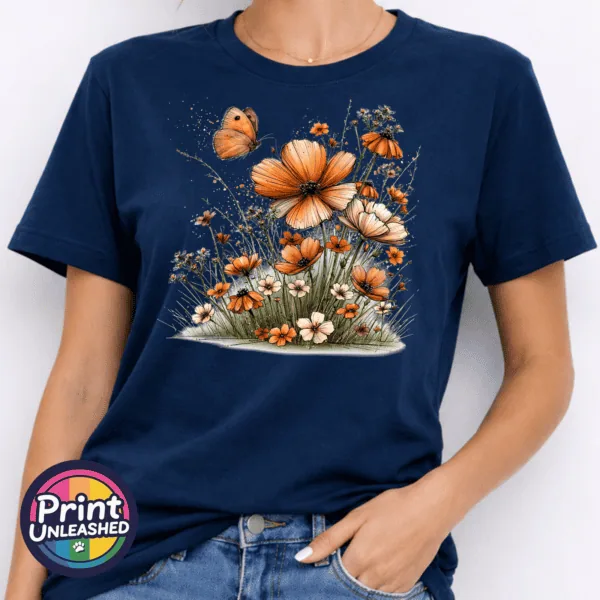 Wildflowers model Copper, peach and cream wildflowers with delicate grasses and an orange butterfly printed on a navy unisex T-shirt model - Print Unleashed