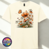 Copper, peach and cream wildflowers with delicate grasses and an orange butterfly printed on a unisex T-shirt off white - Print Unleashed