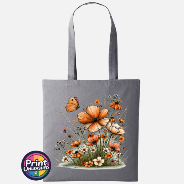 Copper, peach and cream wildflowers with delicate grasses and an orange butterfly printed on a tote bag slate - Print Unleashed