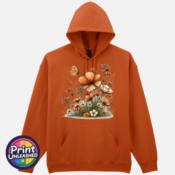 Copper, peach and cream wildflowers with delicate grasses and an orange butterfly printed on a softstyle hoodie in texas orange - Print Unleashed