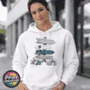 Snow-covered signpost pointing to Winter Wonderland, Frosty’s Freeze, Silver Bell Lane and the Ice Palace, with blue and silver decorations, printed on a white unisex hoodie female model - Print Unleashed