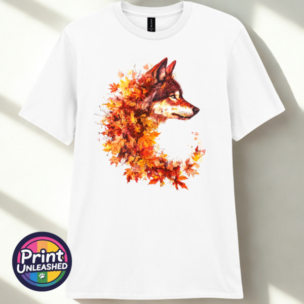Wold white Wolf in profile with a golden eye and fur blending into red, orange and golden autumn leaves on a unisex T-shirt white - Print Unleashed