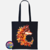 Wolf in profile with a golden eye and fur blending into red, orange and golden autumn leaves on a tote bag black - Print Unleashed