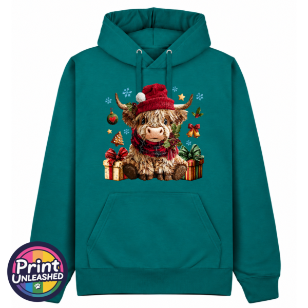Model wearing a Classic Hoodie featuring a fluffy Highland calf in a red Christmas hat and checked scarf, surrounded by presents and festive decorations, pacific colour - Print Unleashed