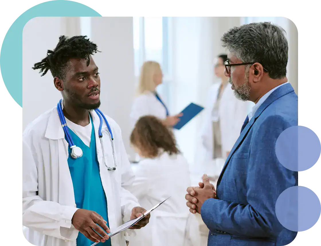 Doctor and patient discussing health in a medical setting at Proficient Health.